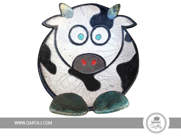 Handmade ceramic plate in a cow shape